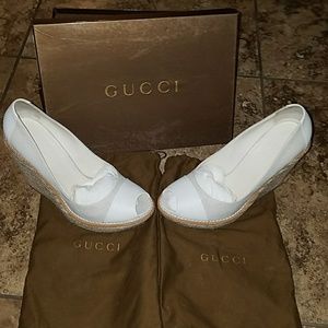 Gucci wedge heels with logo.
